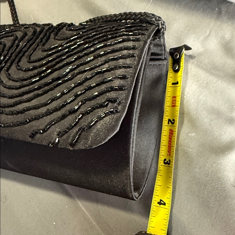 Elegant Black Beaded Evening Clutch
Plus free sheer shoulder wrap. - Picture 9 of 10
